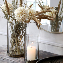 Load image into Gallery viewer, cream candle inside antique brass hurricane lantern
