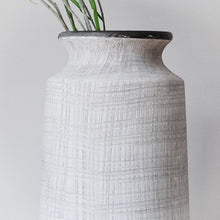 Load image into Gallery viewer, Close up of grey/stone urn vase with dark grey lip. Textured with line markings

