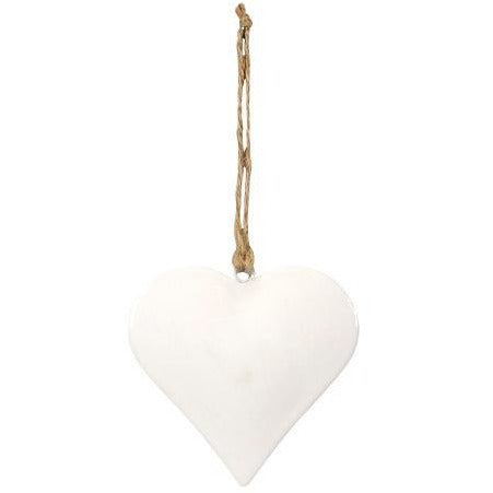 white metal heart ornament on jute string